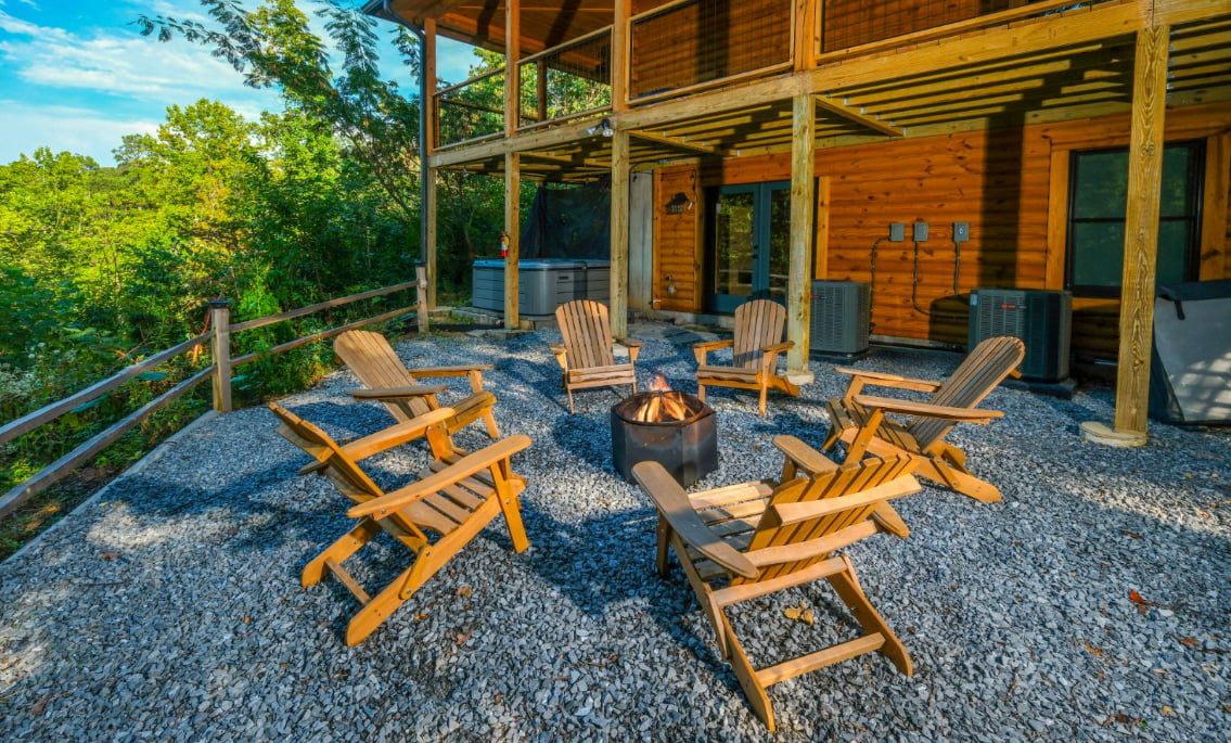 Lit fire pit with six chairs