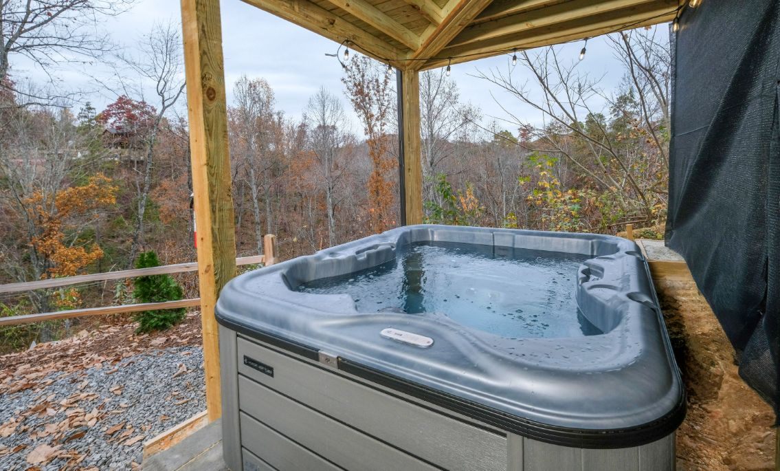 Hot tub on the covered deck with mountain view